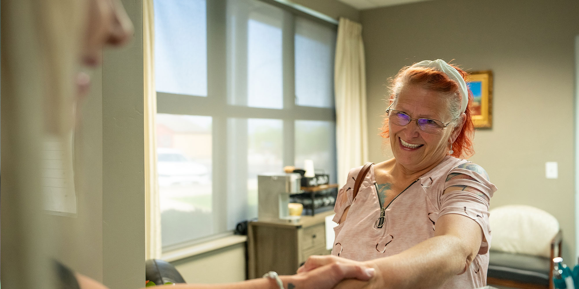 patient being helped at the front desk of the dental center